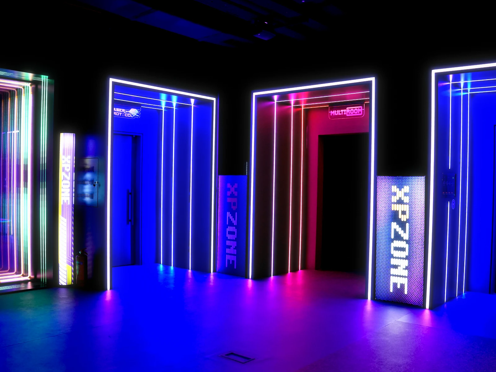 The neon corridor and game room doors at XPZONE Istanbul
